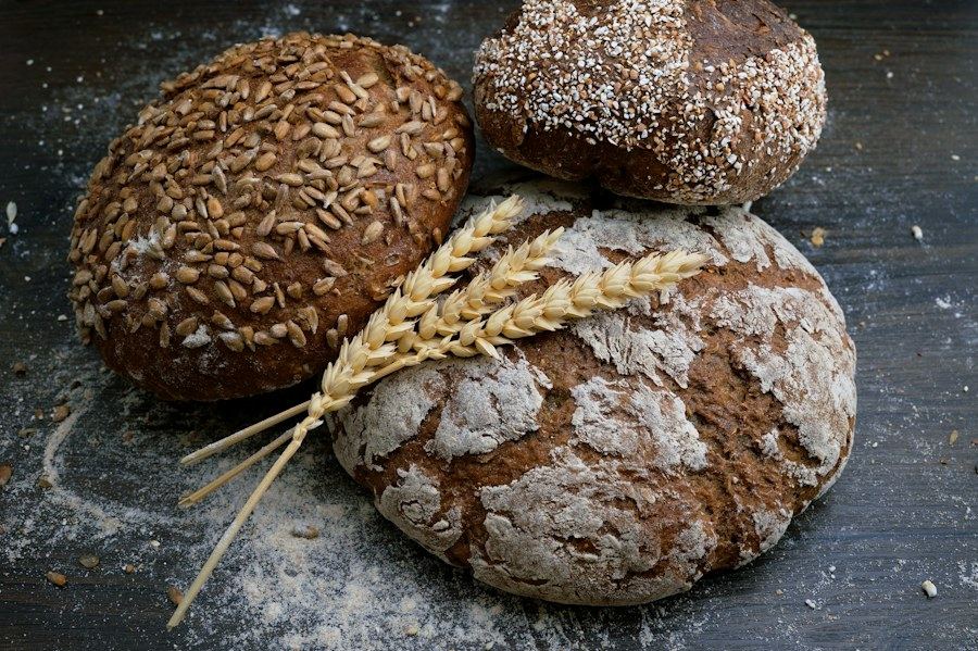 Freshly baked seeded and flour-dusted sourdough loaves